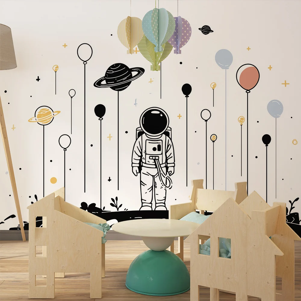 Tapety dla dzieci | Astronauta i kolorowe planety w kosmosie